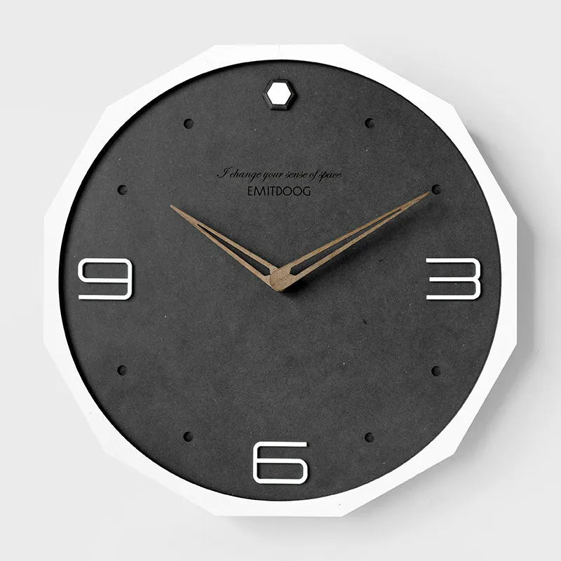 Circular 12-inch Nordic style wall clock with perforated numerals in minimalist design