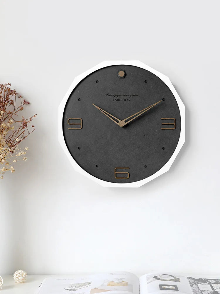 Circular 12-inch Nordic style wall clock with perforated numerals in minimalist design