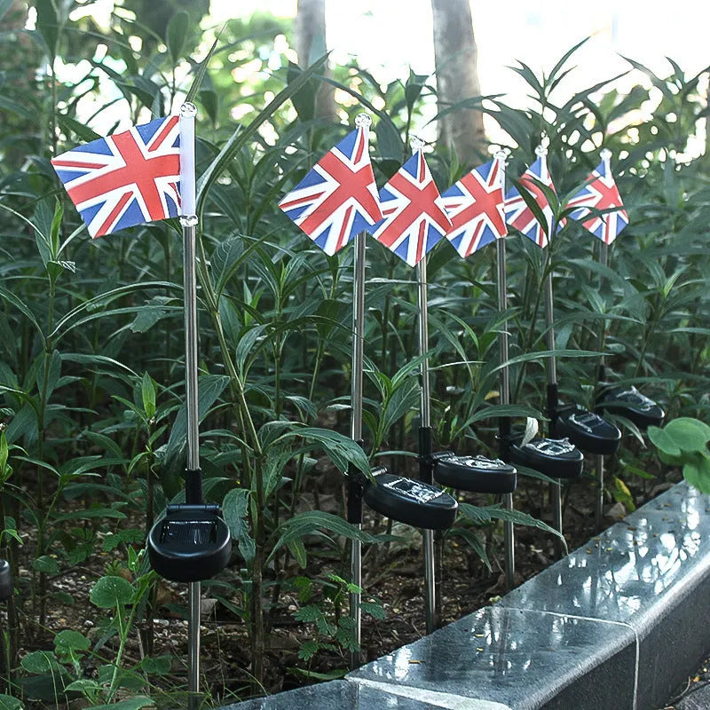 Solar garden flag light with stainless steel pole showing either American or British flag design.