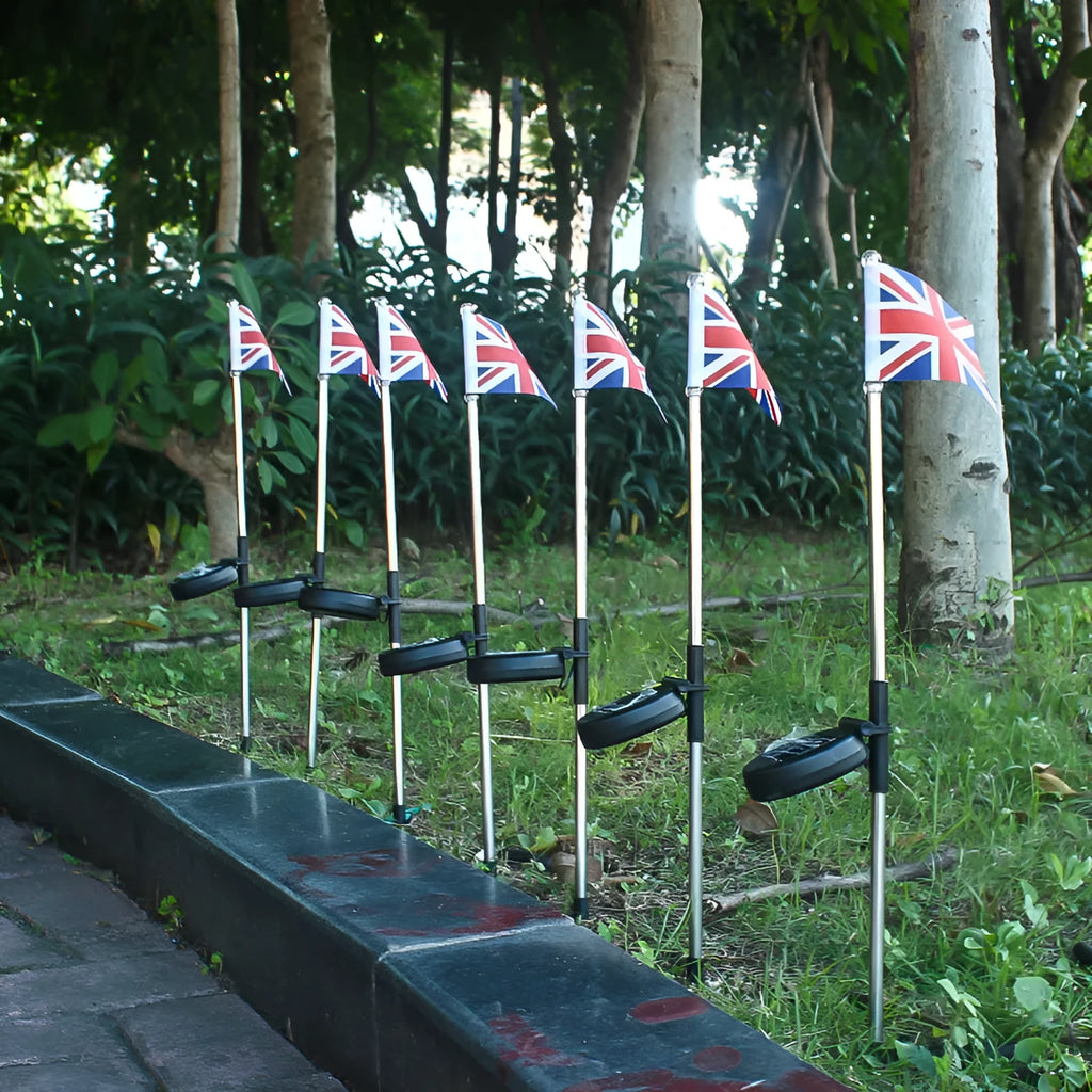 Solar garden flag light with stainless steel pole showing either American or British flag design.
