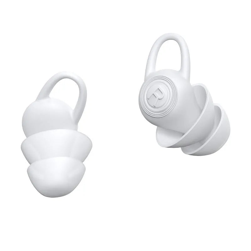 White soft silicone ear plugs for noise reduction in sealed packaging