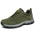 Men's army green low-top hiking shoes on a neutral background, showing the casual design and tread.