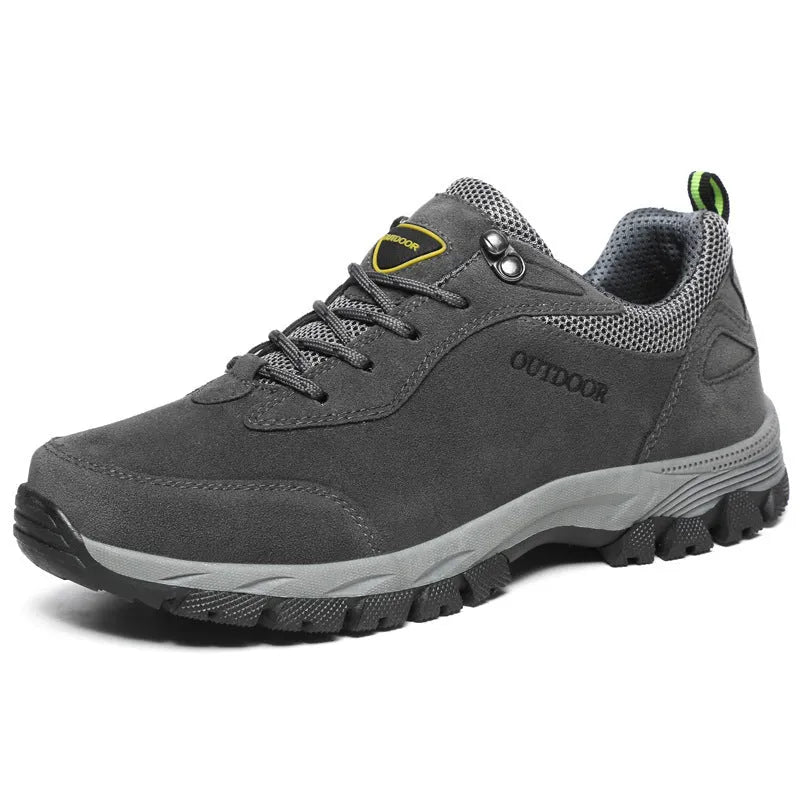 Men's army green low-top hiking shoes on a neutral background, showing the casual design and tread.