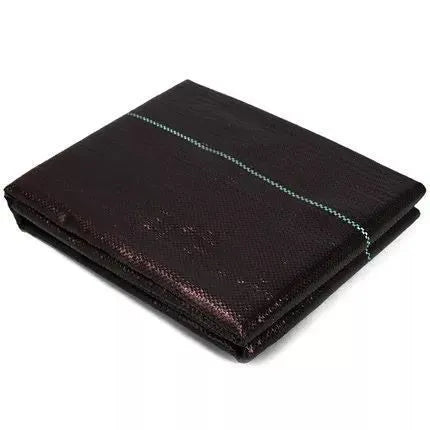 Black polyethylene weed-proof cloth laid out on soil for greenhouse or farmland ground cover.