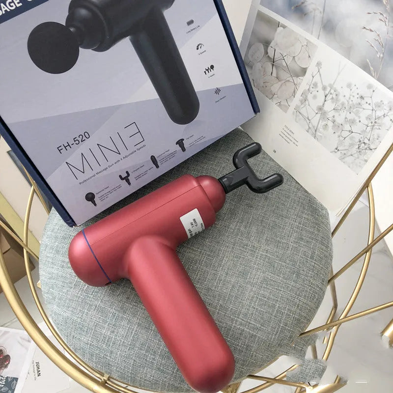 Grey fascia gun massager with USB charging port for muscle relaxation therapy