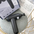 Grey fascia gun massager with USB charging port for muscle relaxation therapy