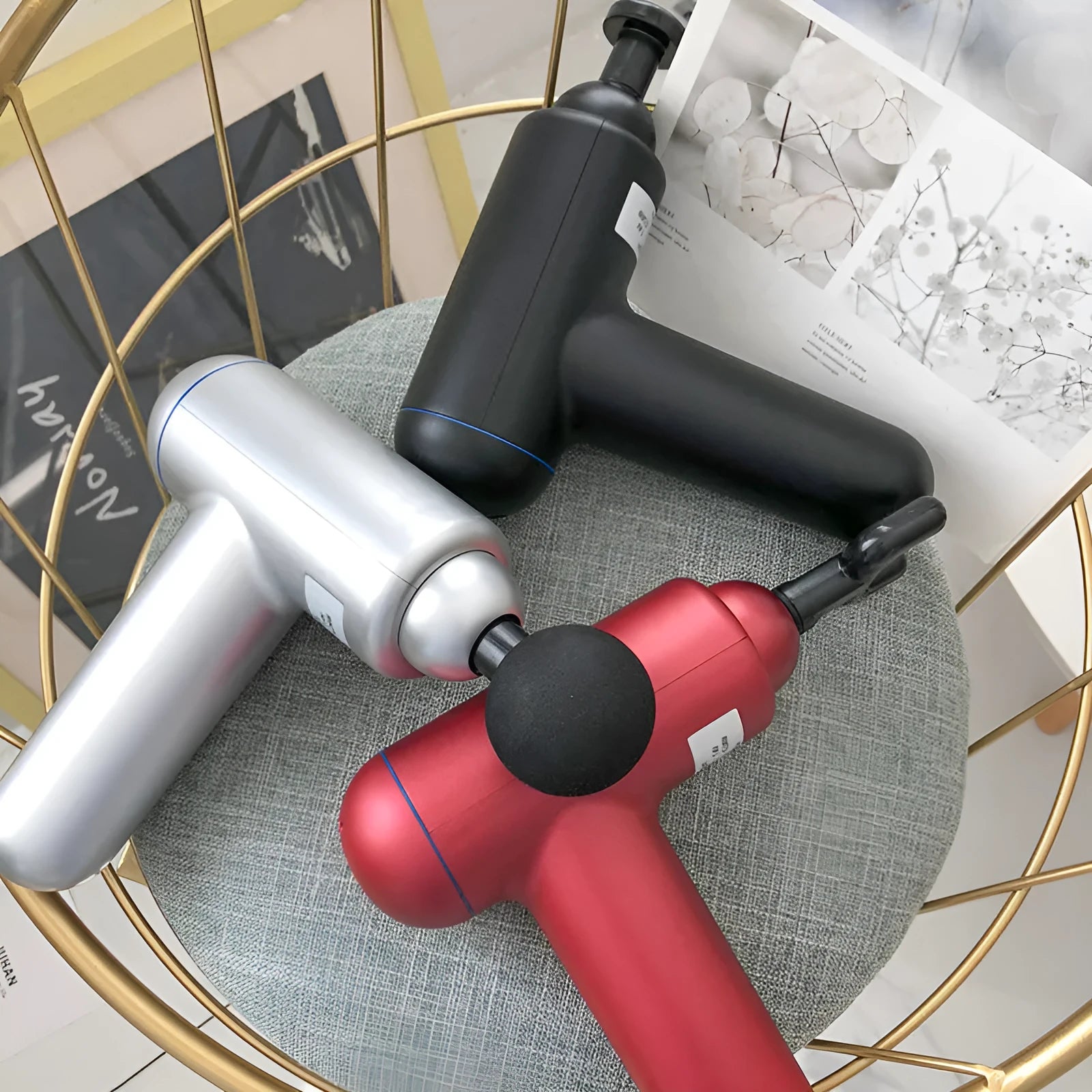 Grey fascia gun massager with USB charging port for muscle relaxation therapy