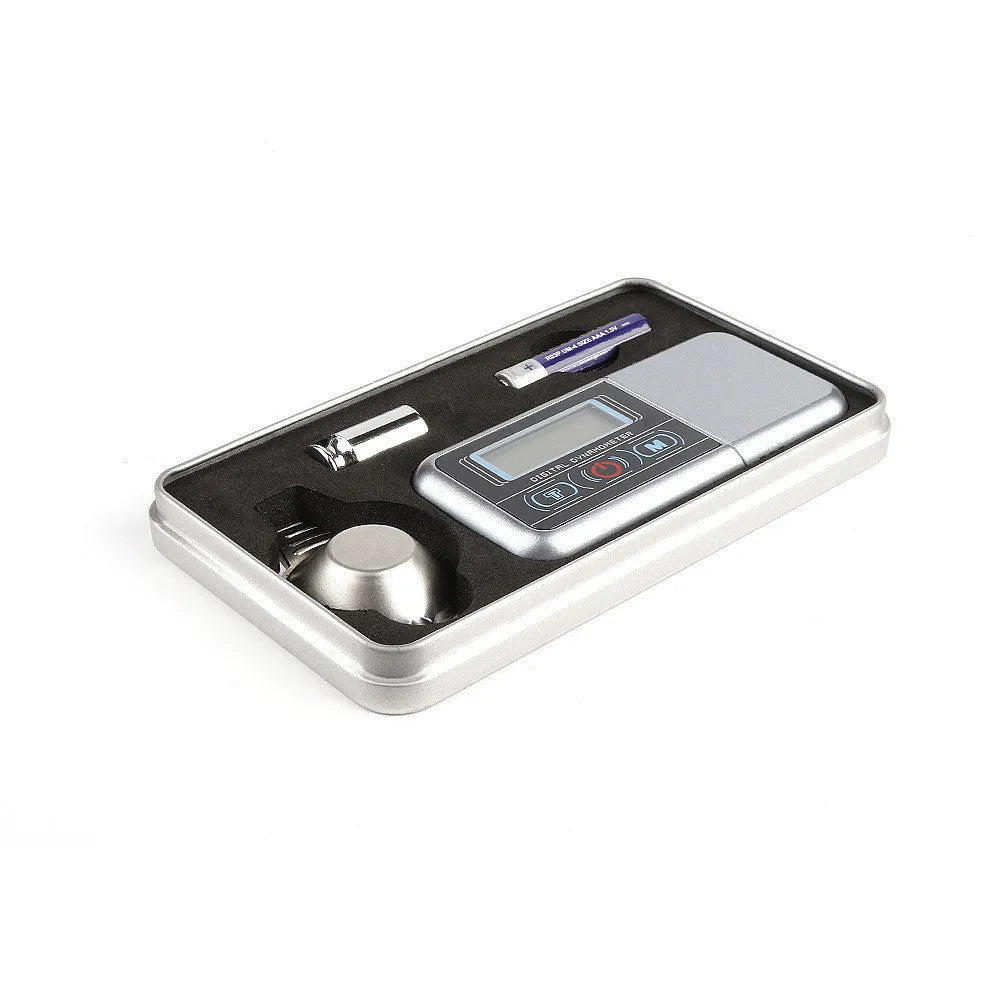 Black electronic precision scale with 100g capacity and 0.005g accuracy for jewellery and vinyl needles