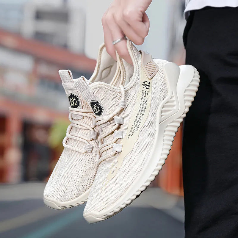 Men's low-top white mesh sports shoes with black rubber sole and lace-up front.