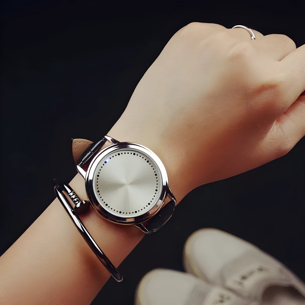 Electronic digital watch with blue LED display showing time numbers