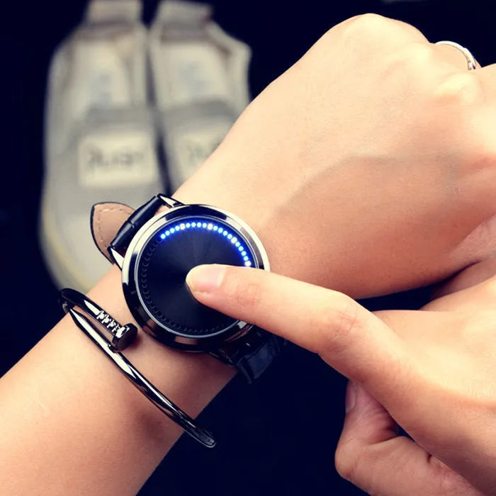 Electronic digital watch with blue LED display showing time numbers