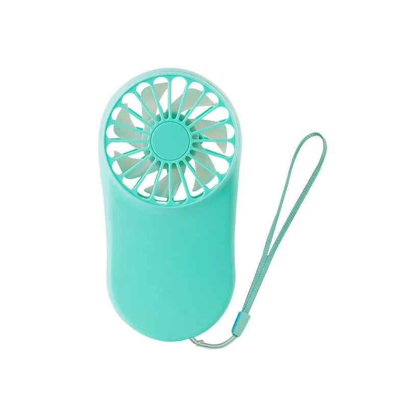 A person wearing a black hands-free neck fan with dual blue cooling fans and a USB charging cable.