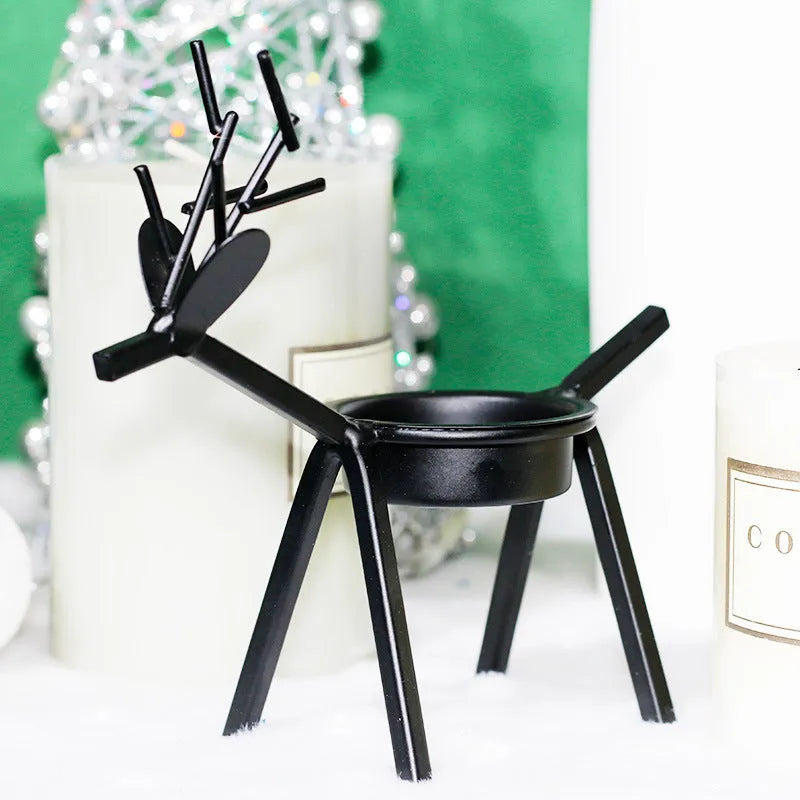 Black iron Christmas candlestick holder with creative elk bracket design for table decoration.