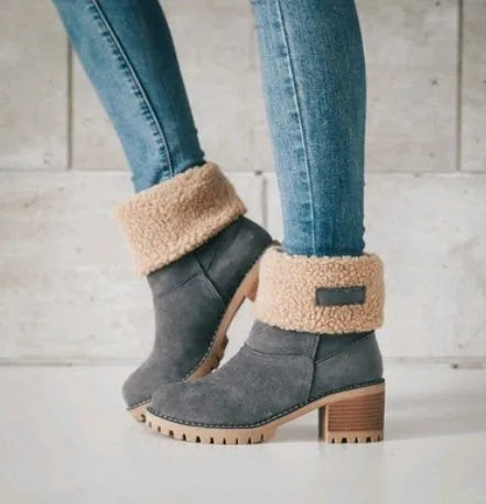 Women's thick suede mid-calf snow boots with a round toe, flat low heel, and waterproof platform sole.