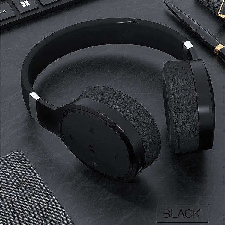 Wireless Bluetooth over-ear headset in black, shown with its packaging box.