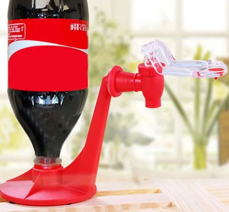 Red plastic Magic Tap soda dispenser attached to inverted 2 litre bottle