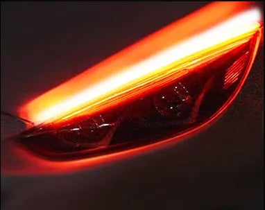 Flexible silicone car LED daytime running light strip with flowing turn signal animation, shown in multiple colours.