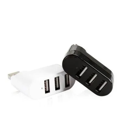 Black and white 4-port USB 2.0 splitter hub shown next to a laptop