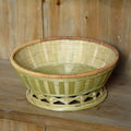 Handmade woven bamboo storage basket in natural colour showing traditional craftsmanship