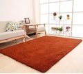 Solid colour fluffy plush rectangle carpet showing soft pile and non-slip dotted bottom.
