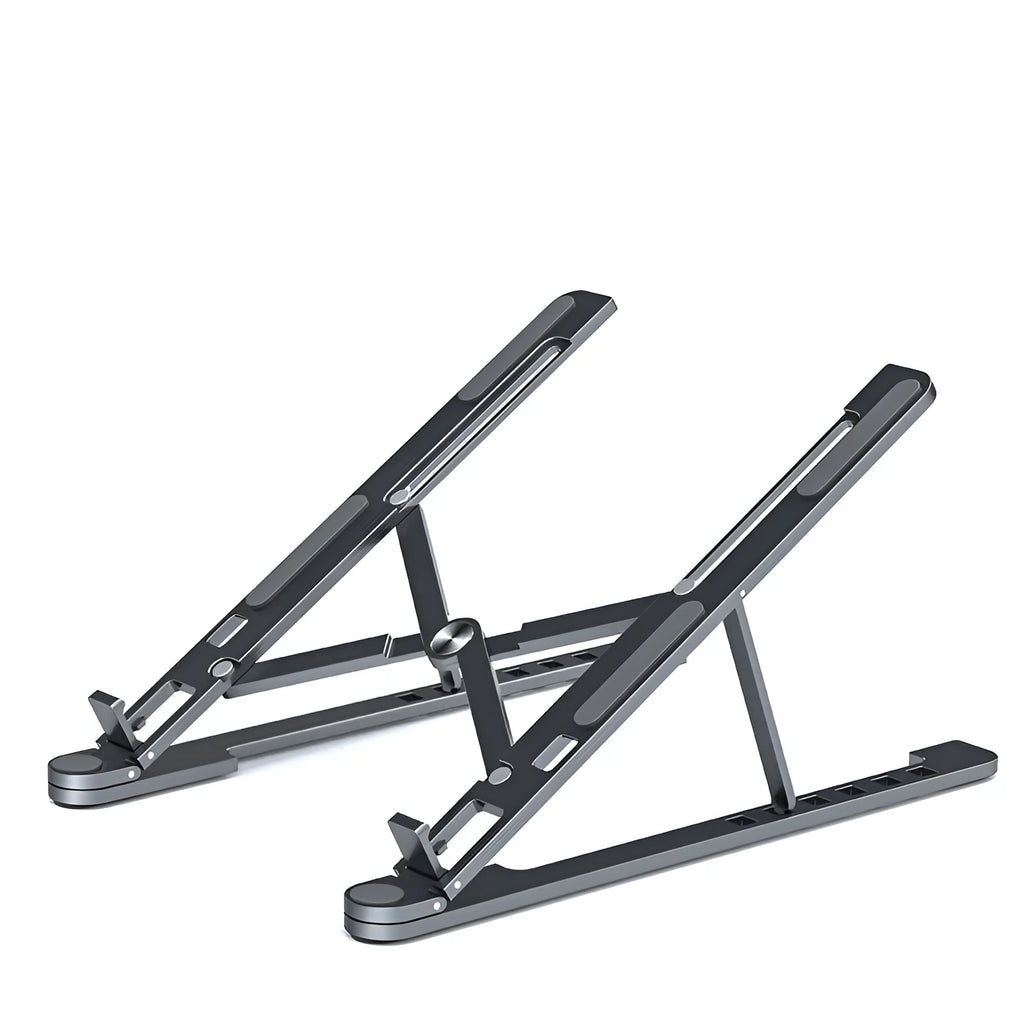Silver foldable aluminium laptop stand holding a MacBook at an angle, shown next to a backpack.