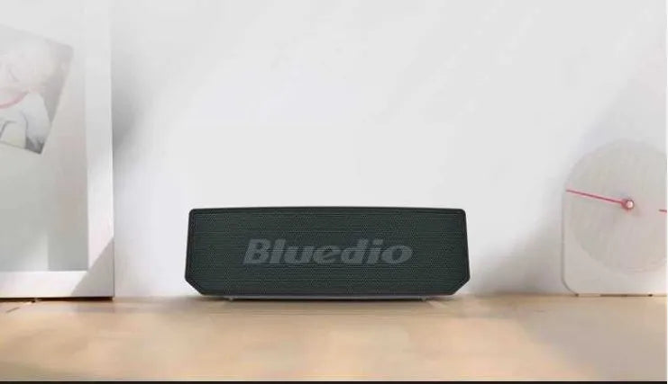 Black rectangular BS-6 cloud smart speaker with Bluetooth connectivity on desktop