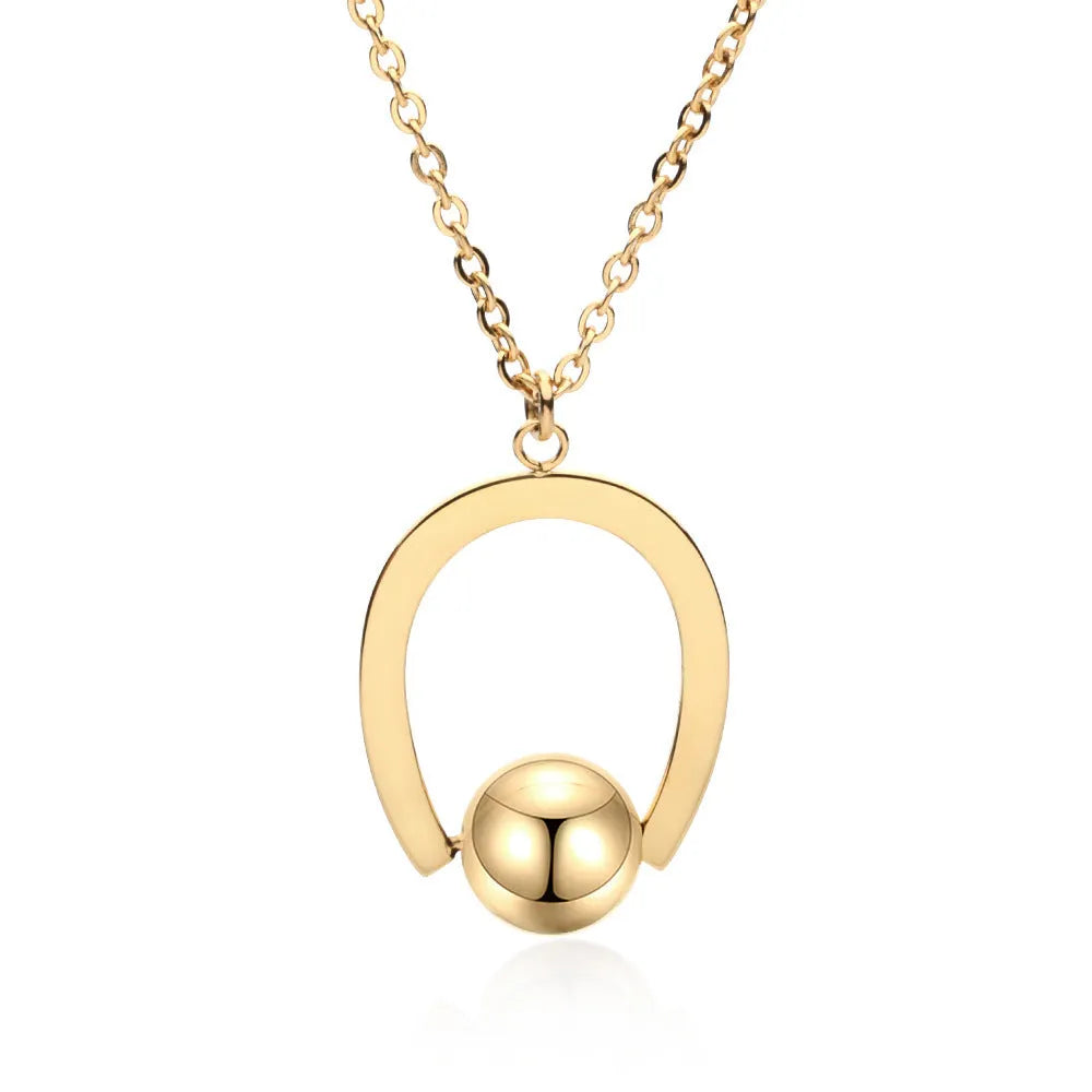 Stainless steel necklace with geometric pendant on a cross chain, in gold or silver colour.