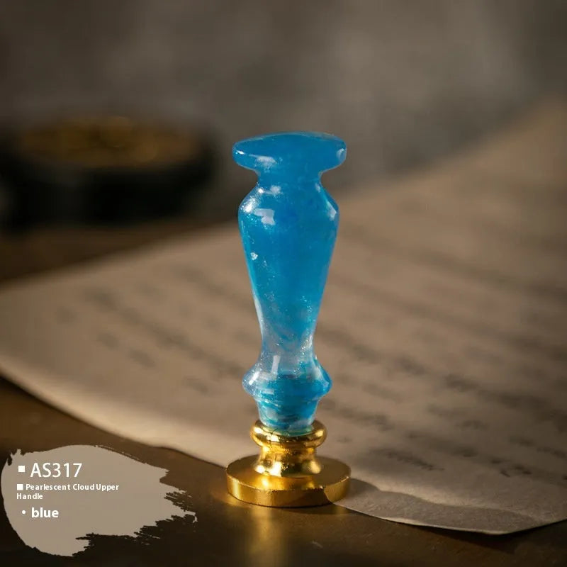Wooden wax seal handle in a selection of different colour and decorative finishes.