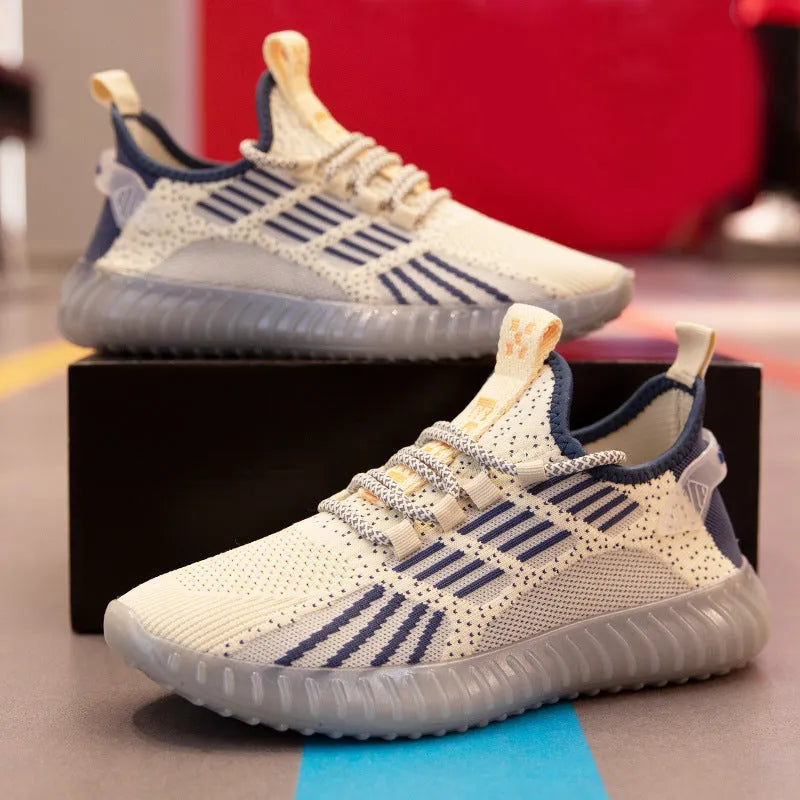 Men's white breathable flying fabric sports shoes with round toe and flat heel on a model.
