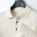 Man wearing a men's grey polo collar wool sweater pullover with long sleeves.