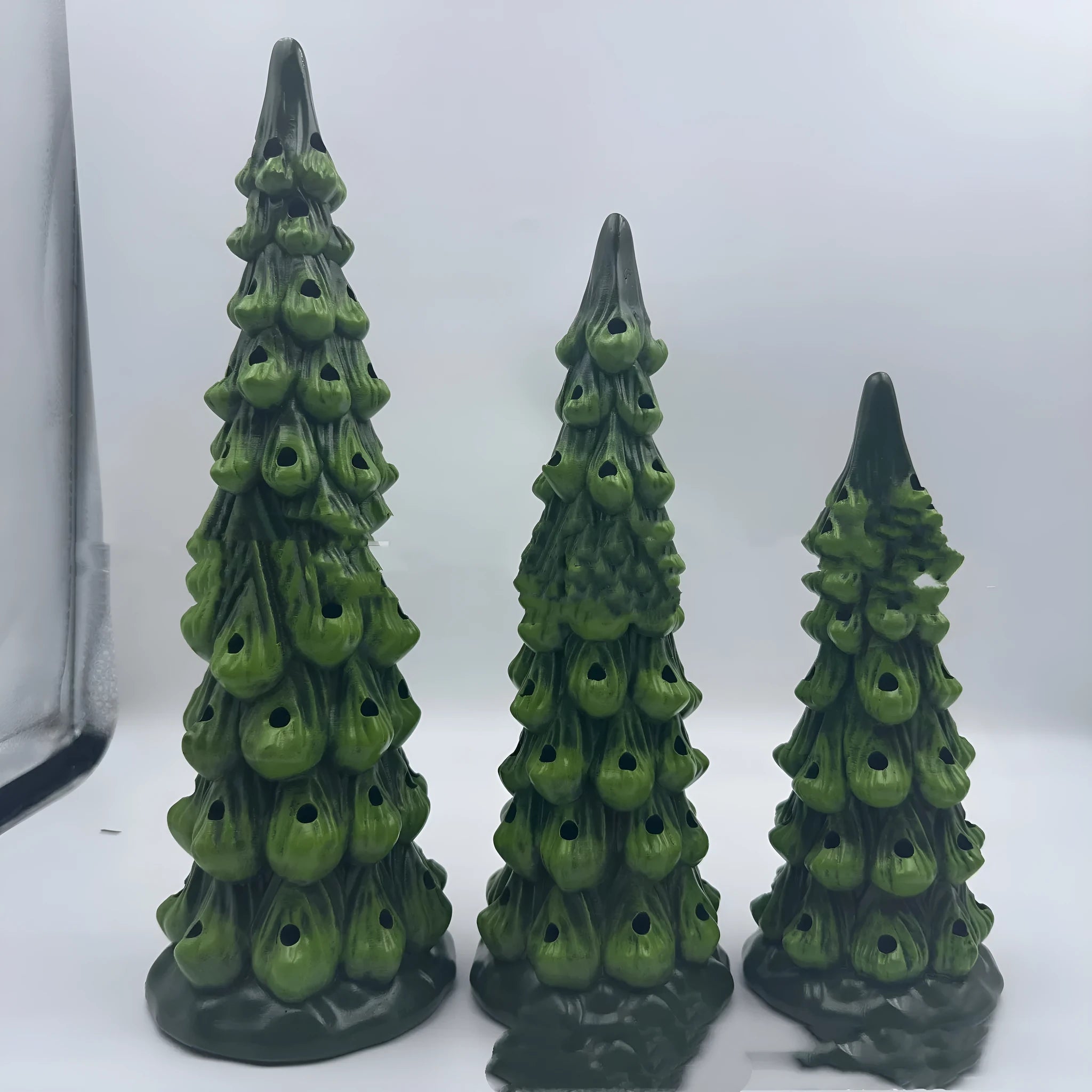 European-style Christmas tree ornament with lights, shown in different sizes for home or courtyard.