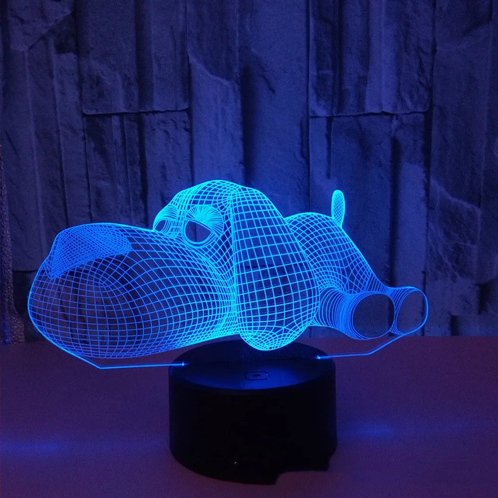 Dog-shaped desktop lamp glowing in blue with touch button and USB power cable