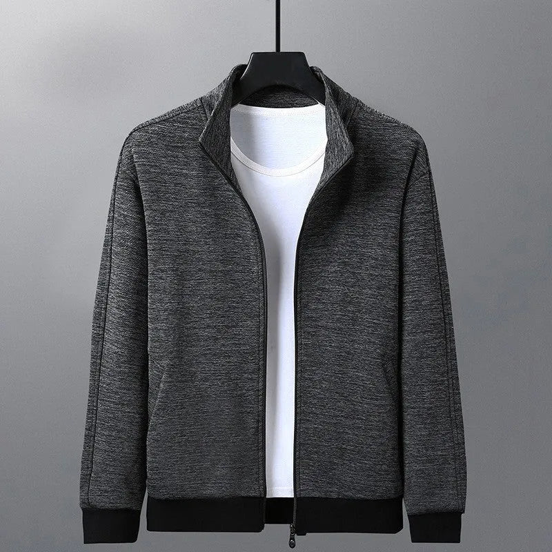 Men's black athletic jacket with a stand-up collar and front zip, showing a close-fitting cut