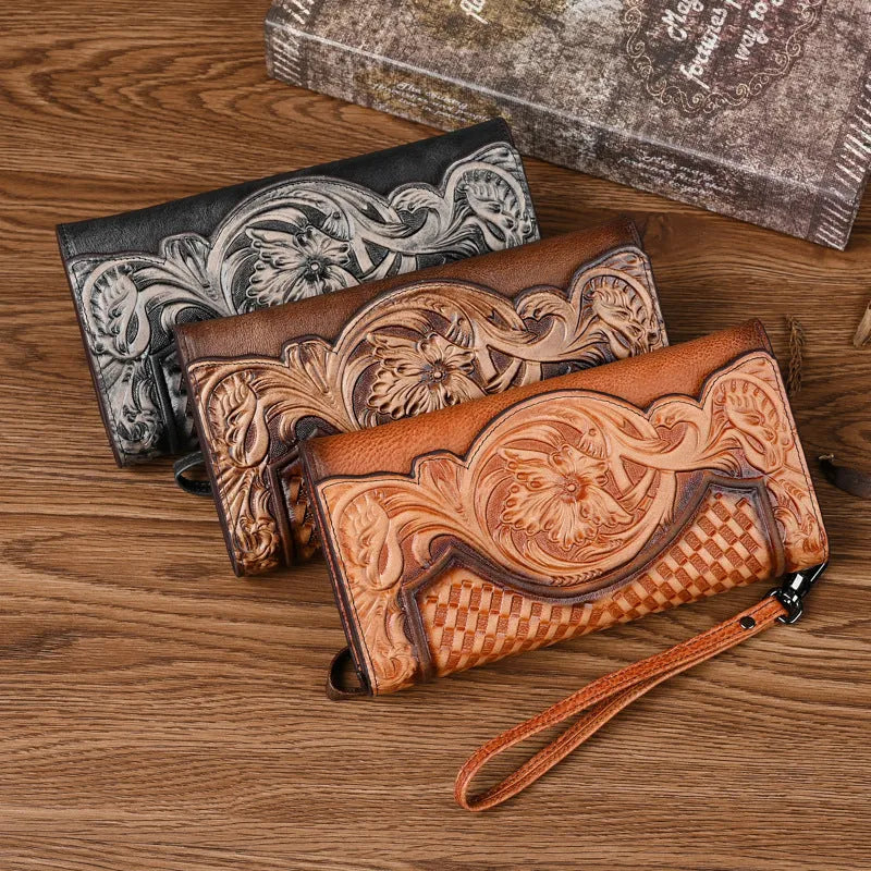 Chinese style embossed women's tri-fold wallet in genuine cowhide leather showing floral pattern detail