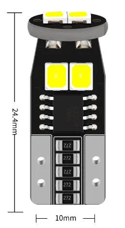 Small white LED car lamp for licence plate lighting on a fibre-glass board.