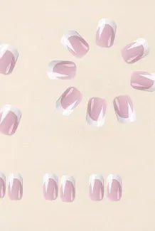 24 white square fake nails with a black and white plaid pattern, laid out on a surface.