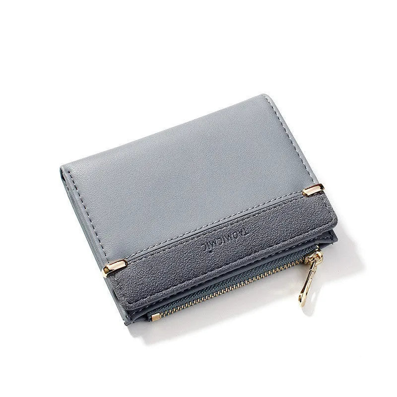 A two-fold PU leather ladies wallet with a zipper, shown in multiple colours, displaying internal card slots and compartments.