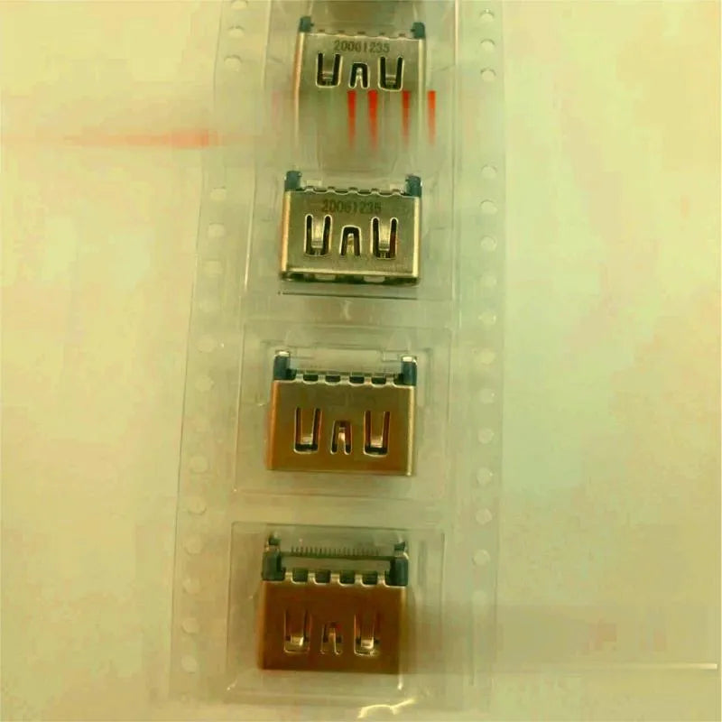 Silver-coloured HDMI host socket interface for game console repair.