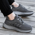 Breathable non-slip casual shoes with mesh upper and elastic band closure in black, dark grey, purple, and purplish red.