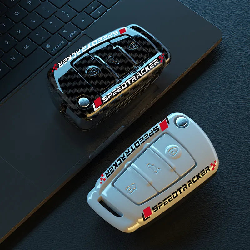 Carbon fibre style car key holder cover in white and carbon colour options with a small mirror.