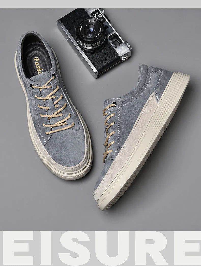 Men's grey and sand coloured low-top casual skate shoes with round toe and lace-up front.