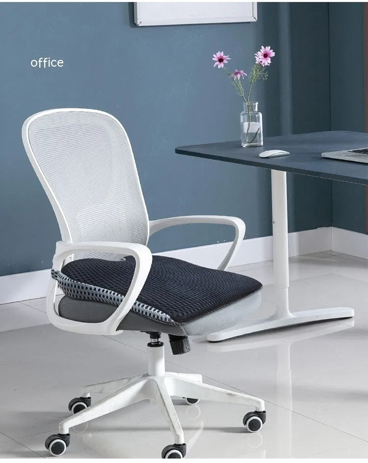 Solid colour memory foam cushion with an attached strap, shown on a car seat.