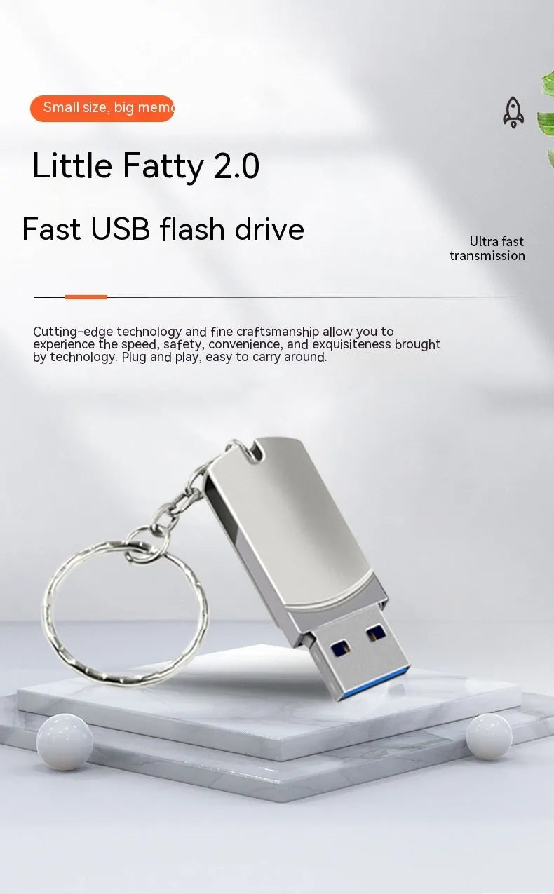 White small fat USB flash drive with rotating metal casing showing 16GB capacity