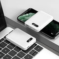 Black or white portable power bank with USB ports showing 10000mAh capacity for mobile device charging
