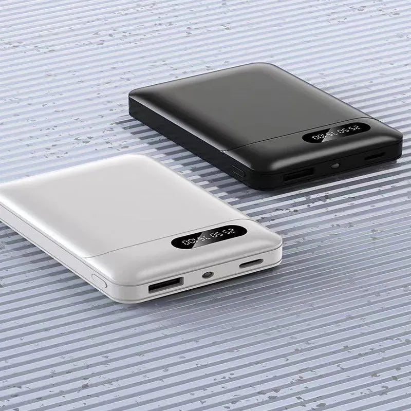 Black or white portable power bank with USB ports showing 10000mAh capacity for mobile device charging