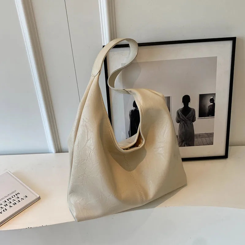 Casual soft leather shoulder bag with sandwich pockets in various colour options