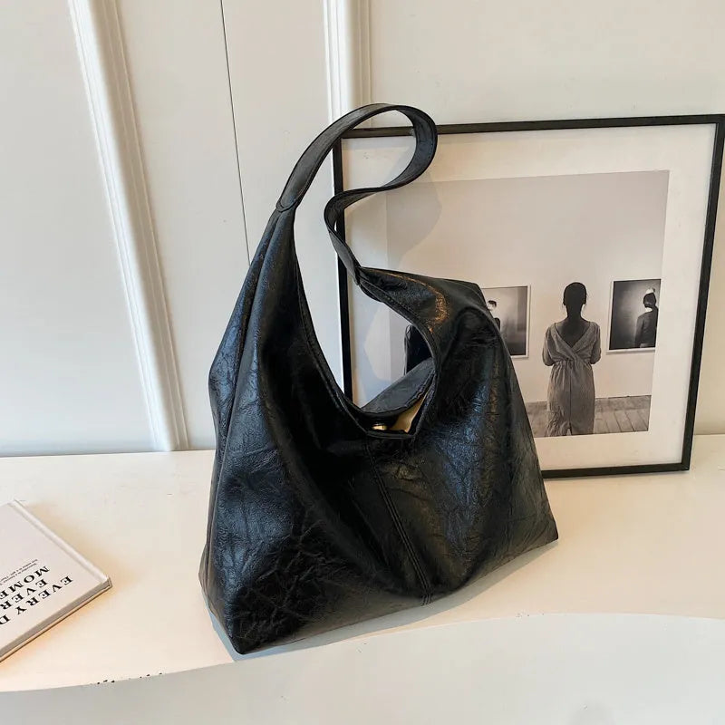 Casual soft leather shoulder bag with sandwich pockets in various colour options