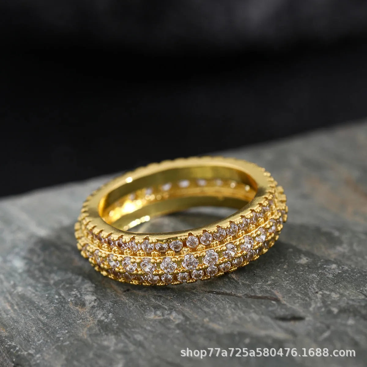 Geometric triangle zircon ring in three colour options showing detailed inlay work
