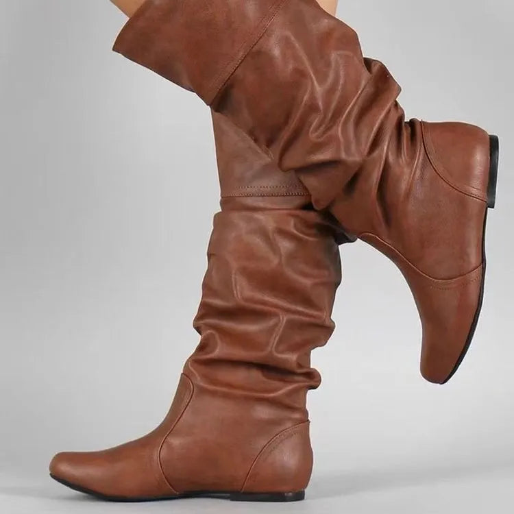 Women's slip-on flat ankle boots in artificial PU leather with high shaft and rubber sole