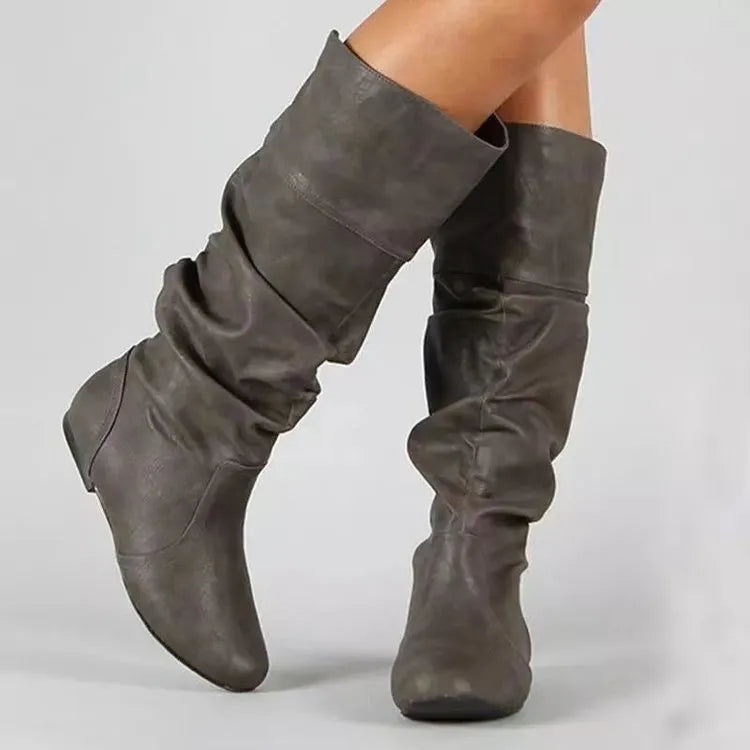 Women's slip-on flat ankle boots in artificial PU leather with high shaft and rubber sole